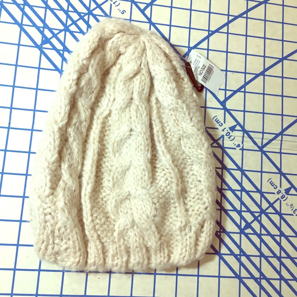 Cream colored acrylic NWT knit hat from wet seal